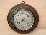 Rare wall barometer with 'Hurricane' forecast, signed Lennie Edinburgh